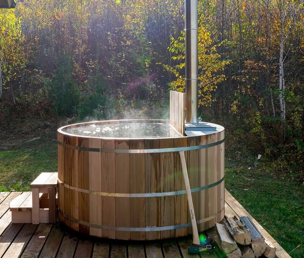 Wood hot tub with internal interior wood fired heater